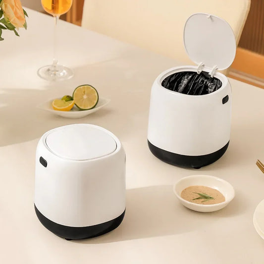 Mini desktop trash can in white with a black base, shown with the lid open and closed, ideal for office or home use.