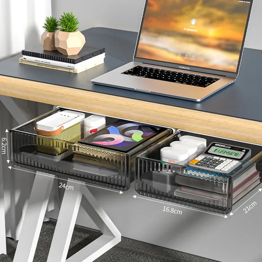 Under-desk pull-out storage drawers showcasing organized stationery, electronics, and small items, attached to a modern desk setup.